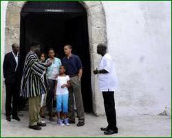 President Barack Obama with wife Michelle and daugther Sasha and Malia at the 'door of no return' in Cape Coast Castle Ghana.